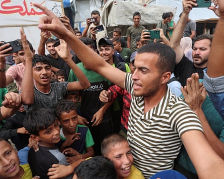 Palestinians celebrate in Khan Younis after Donald Trump announced Israel and Hamas agreed on the first phase of a Gaza ceasefire.