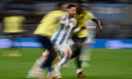 Lionel Messi bursts through the attentions of Ecuador’s Pervis Estupinan, left, and Moises Caicedo in typically captivating style