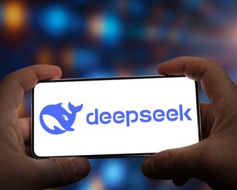 Hands holding smartphone with DeepSeek logo on the screen