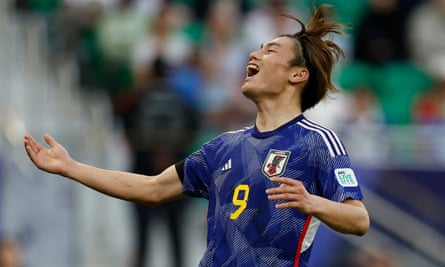 Japan's Ayase Ueda celebrates his goal against Vietnam