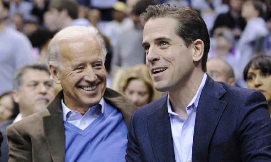 Then Vice President Joe Biden, left, and his son Hunter Biden appear at the Duke Georgetown NCAA college basketball game in Washington in 2010.