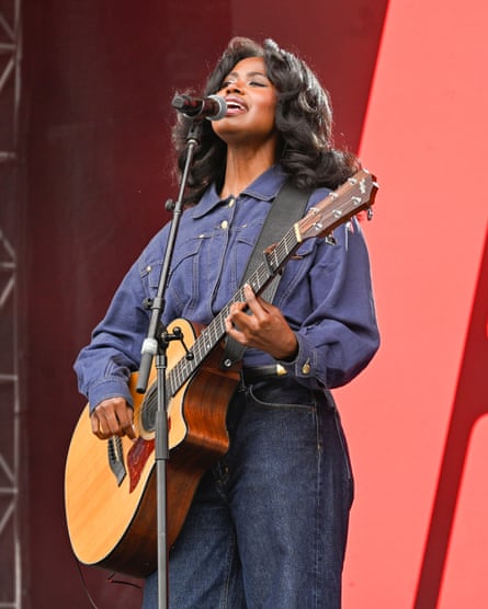 a woman singing on stage