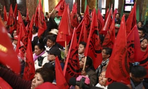 Farm workers block the entrance of the Fine Arts Palace to protest against the painting.