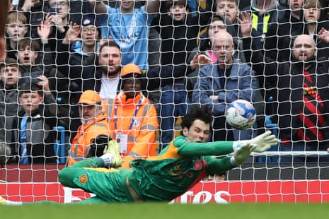 James Trafford dive to parry Salah’s penalty.