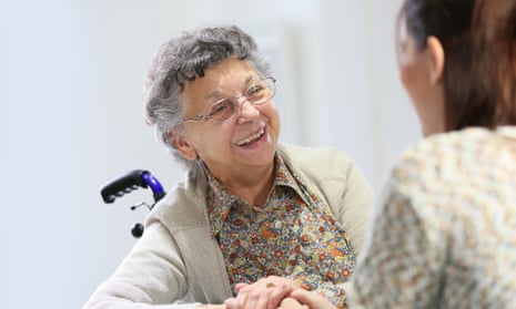 Elderly woman sharing good time with carer