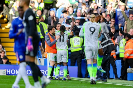 Jérémy Doku celebrates scoring.
