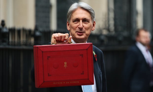 The chancellor, Philip Hammond, presents the red budget box as he departs 11 Downing Street to deliver his 2018 budget.