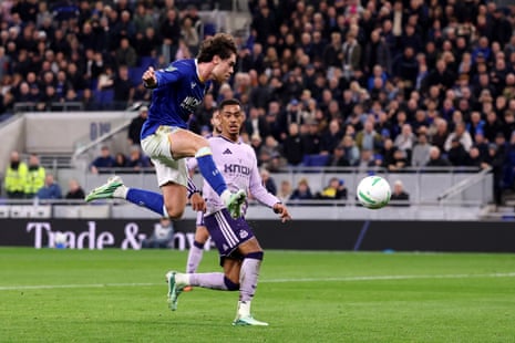 Hayden Hackney leaps to strike the ball past an opposing Newcastle player