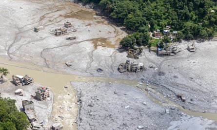 An aerial view of the remains of a village almost wiped out by mud and debris