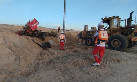 A destroyed vehicle at the scene of the digging.
