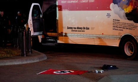 Red flag on the ground with a white and red truck in the back