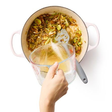 Felicity Cloake’s beer cheese soup - adding the beer to the fried vegetables