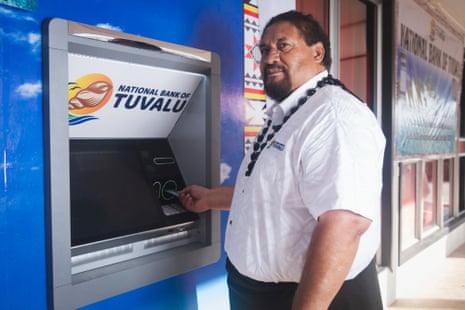National Bank of Tuvalu CEO Siose Penitala Teo tries out the Pacific nation’s first ATM machine