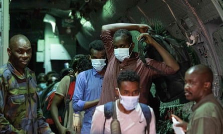 Kenyan and Somali citizens arrive at Jomo Kenyatta airport in Nairobi after being evacuated aboard a Kenya air force jet