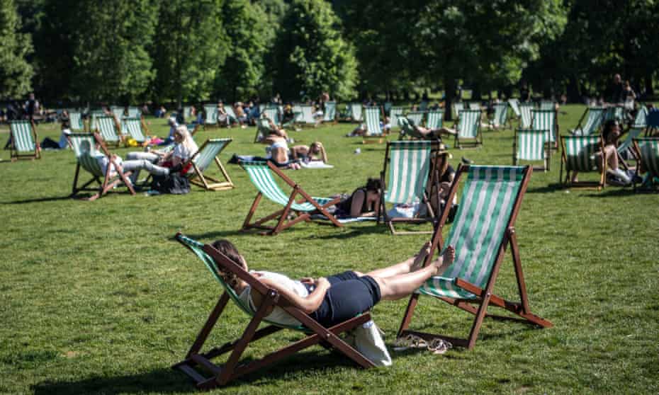 Woman relaxes on deckchair in London.