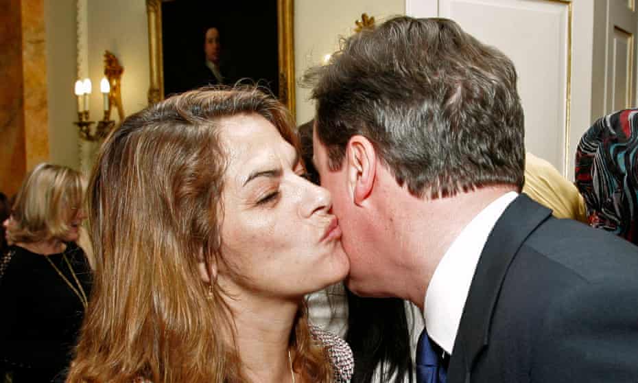 Britain's Prime Minister David Cameron, right, greets British artist Tracey Emin during an International Women's Day reception at 10 Downing Street in March 2011