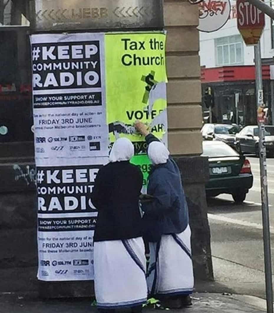 A photo released by the Sex party that it says shows two nuns in Melbourne ripping down one of its posters