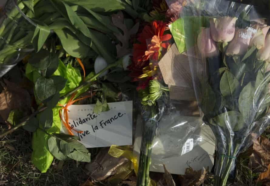Items are left outside the French embassy in Washington DC the day after Paris attacks