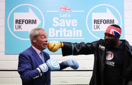Derek Chisoram aims a fake punch at Nigel Farage during the 2024 general election campaign