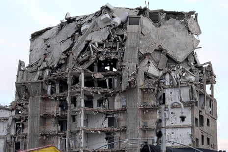 A photo taken while embedded with the Israel Defense Forces (IDF) shows a view of a damaged building in the Palestinian town of Beit Lahia, on the outskirts of the city of Gaza, northern Gaza Strip.