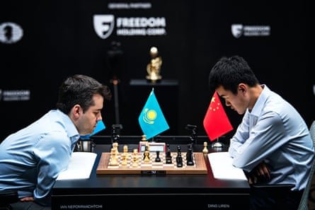 Ding Liren, right, and Ian Nepomniachtchi face off during Sunday’s climactic rapid tiebreak playoff.