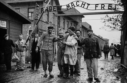 Red Army soldiers leading the survivors out of the death camp. Poland, late January 1945