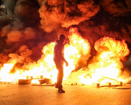 Protesters in the port of Genoa in Italy as news breaks of the interception.