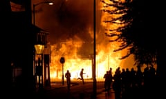 APTOPIX Britain Riot<br>A shop is set on fire as rioters gather in Croydon, south London, Monday, Aug. 8, 2011. Violence and looting spread across some of London’s most impoverished neighborhoods on Monday, with youths setting fire to shops and vehicles, during a third day of rioting in the city that will host next summer’s Olympic Games. (AP Photo/Sang Tan) London riots rioting