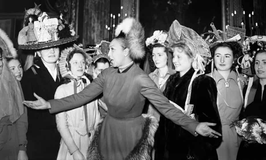 Josephine Baker, centre, collects hats for the French ‘Merci Train’, which left France for the US in January 1949 as a token of gratitude from the French people to the American people for their help in the second world war.