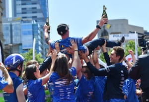 Belgium’s Solar Car Agoria team members celebrate at the finish line of the 2019 World Solar Challenge at Victoria Square in Adelaide