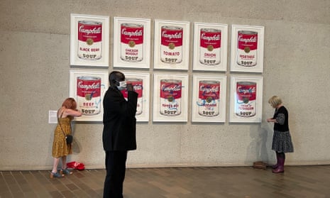Stop Fossil Fuel Subsidies supporters scrawl across Andy Warhol's Campbell's Soup Cans at the National Gallery of Australia