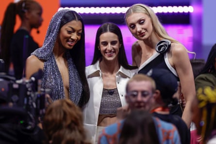 From left to right, LSU’s Angel Reese, Iowa’s Caitlin Clark and Stanford’s Cameron Brink pose for a photo at Monday night’s WNBA draft.