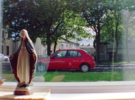 Statue of the Virgin Mary in the window.