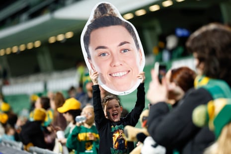 Matildas fan with a giant poster of Mackenzie Arnold’s face