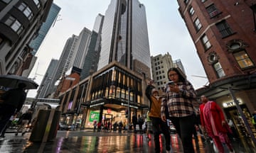 Shoppers make their way through the central business district in Sydney