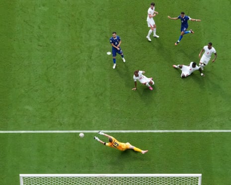 England's keeper Dean Henderson claws away a shot from France's Kylian Mbappe.