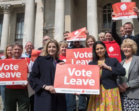 Patel, Mordaunt and supporters hold up 'vote leave' posters.