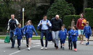 People cross the road at Annandale Public School in Sydney, Australia, 25 May 2020.