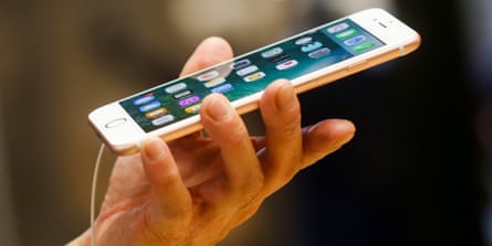 Man’s hand holding a thin mobile phone