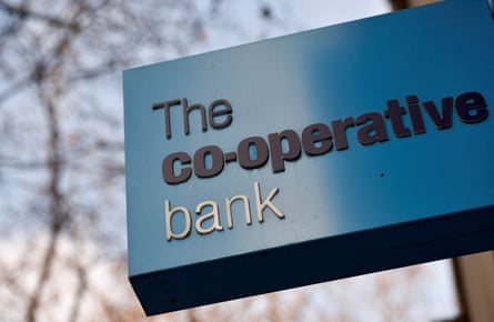 A Co-operative Bank sign hangs outside one of its branches