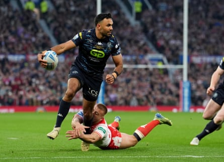 Bevan French (left) is tackled by Hull KR's Mikey Lewis during the 2025 Super League Grand Final