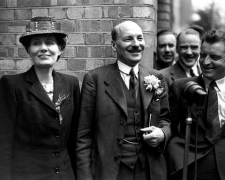 Clement Attlee smiles to well-wishers outside Transport House after Labour’s victory in the 1945 general election. His wife Violet is on the left.