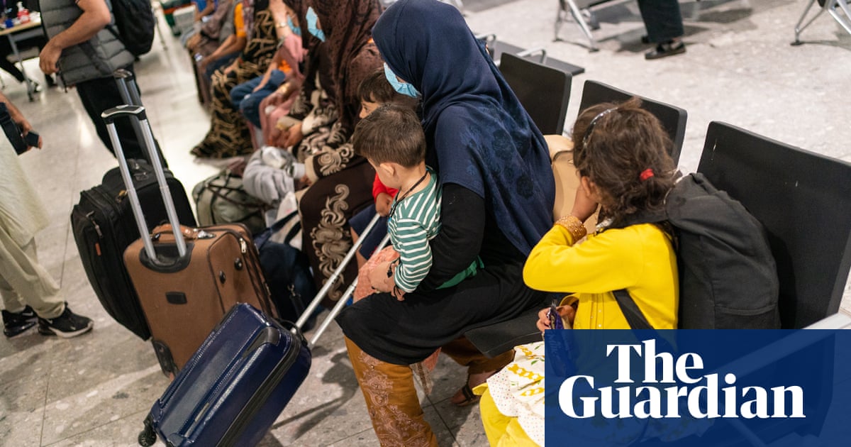 Shoeless, shivering, passing out: Afghan refugees arrive in the UK