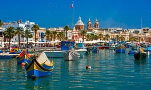 Traditional eyed boats Luzzu in Marsaxlokk, Malta