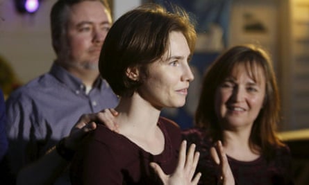 Amanda Knox (centre) talks to the press following the court ruling.
