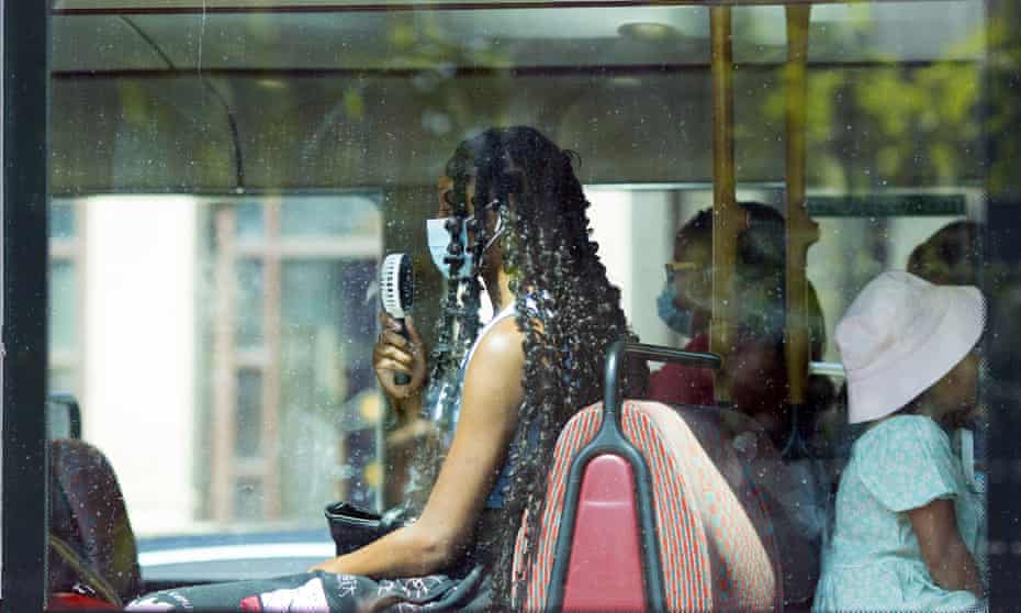 Passenger with fan on London bus
