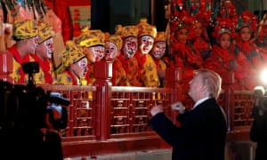 Donald Trump talks to opera performers at the Forbidden City in Beijing.