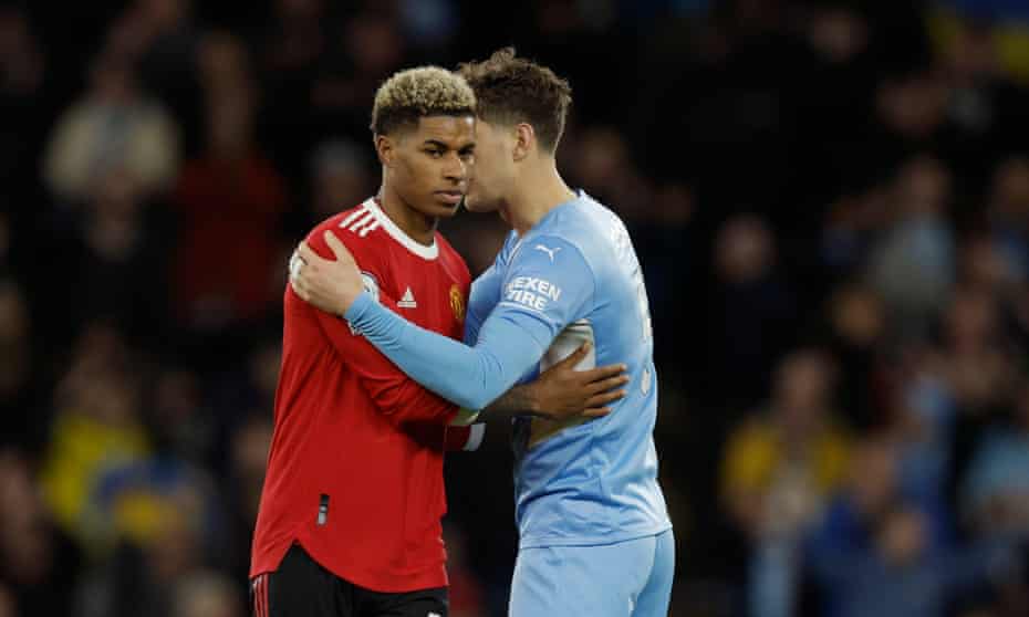 John Stones consoles a dejected Marcus Rashford on the final whistle after Manchester United’s 4-1 defeat.