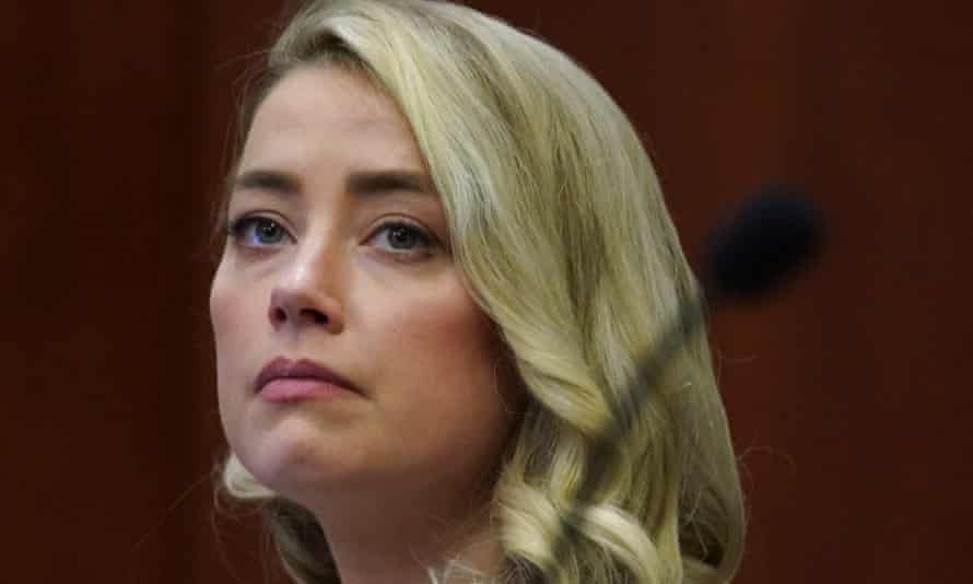Amber Heard watches a previously recorded video deposition by her make-up artist, Melanie Inglessis, during Johnny Depp’s defamation trial in Fairfax, Virginia, last week.