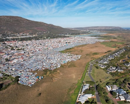 A drone view of an informal settlement extending into wetlands in Cape Town.